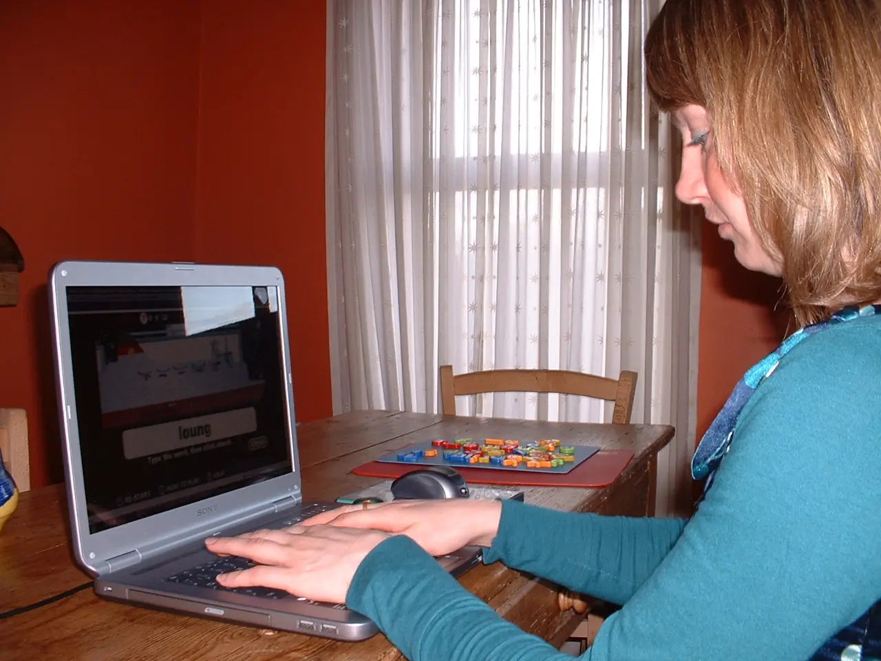 Girl typing on a laptop