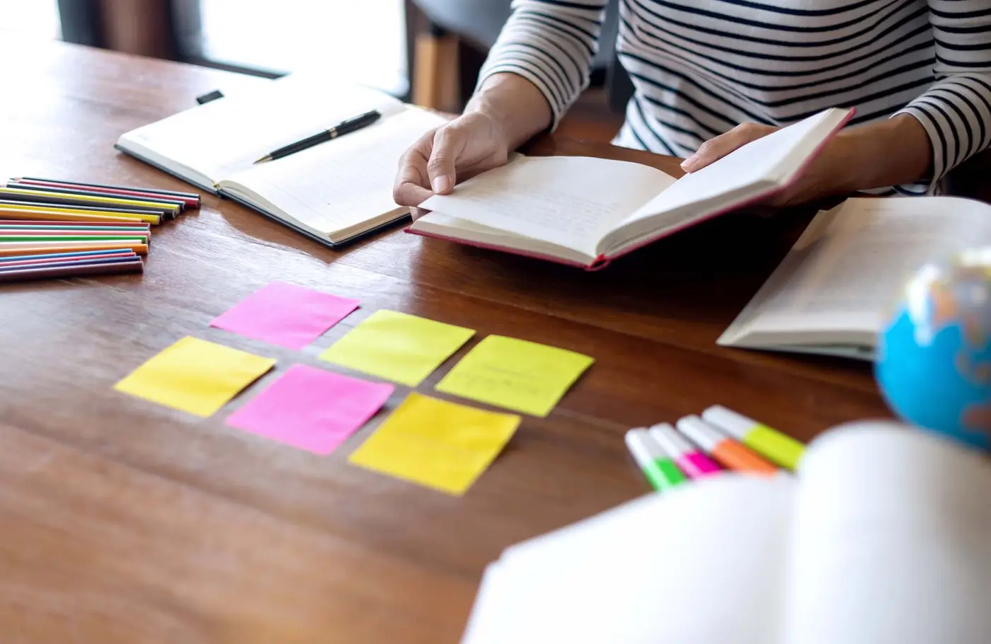 Teacher reading using post it notes